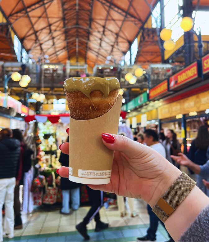 eating chimney cake is a must-do on your 3 days in budapest