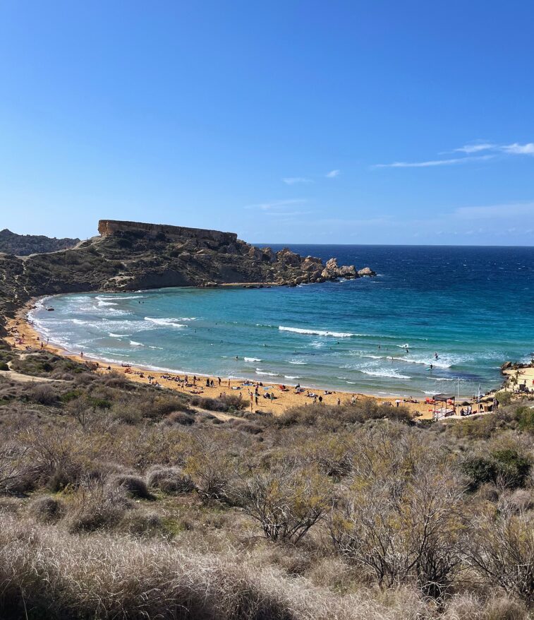 View over Riviera Beach with turquoise water and surrounding hills.