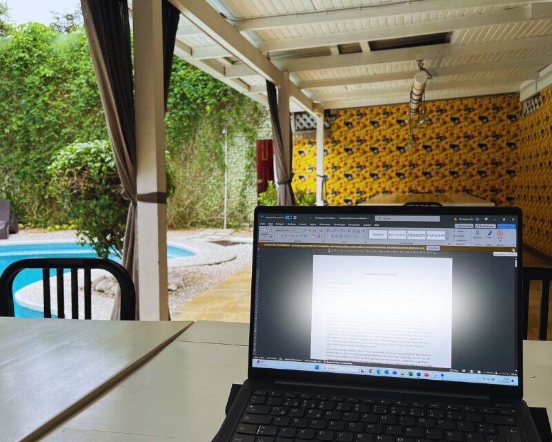 working on a laptop and teaching english in costa rica