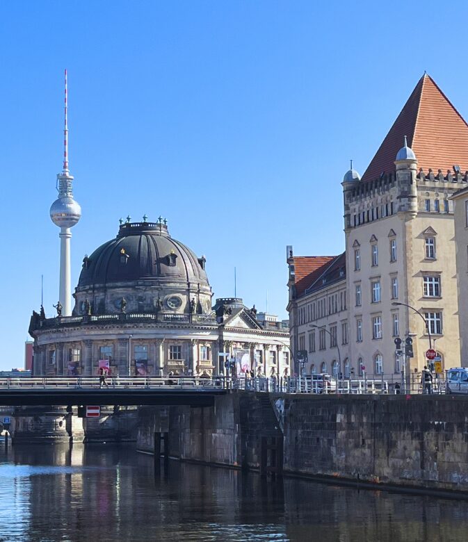 the berlin cathedral and berlin tv tower from the spree