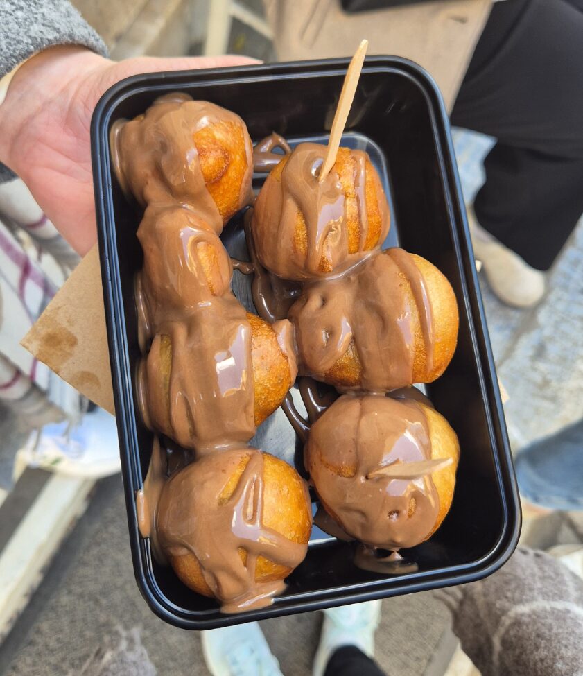 typical greek donuts with chocolate sauce