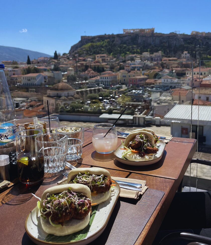 bao buns at attic urban rooftop with acropolis view